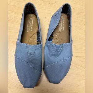 TOMS slip on shoes in light blue. Only worn a couple of times. Size 8.5